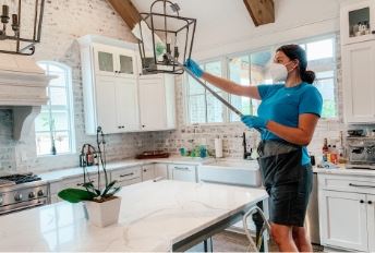 man and woman laughing in a kitchen